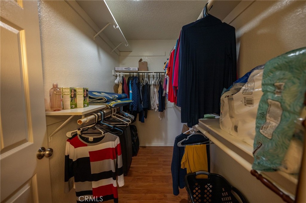 7444 Webster Street Highland, CA 92346 - Photo 25 of 37 a view of walk in closet with clothes and shoes