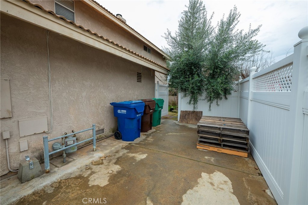 7444 Webster Street Highland, CA 92346 - Photo 35 of 37 a backyard of a house with barbeque oven and seating space