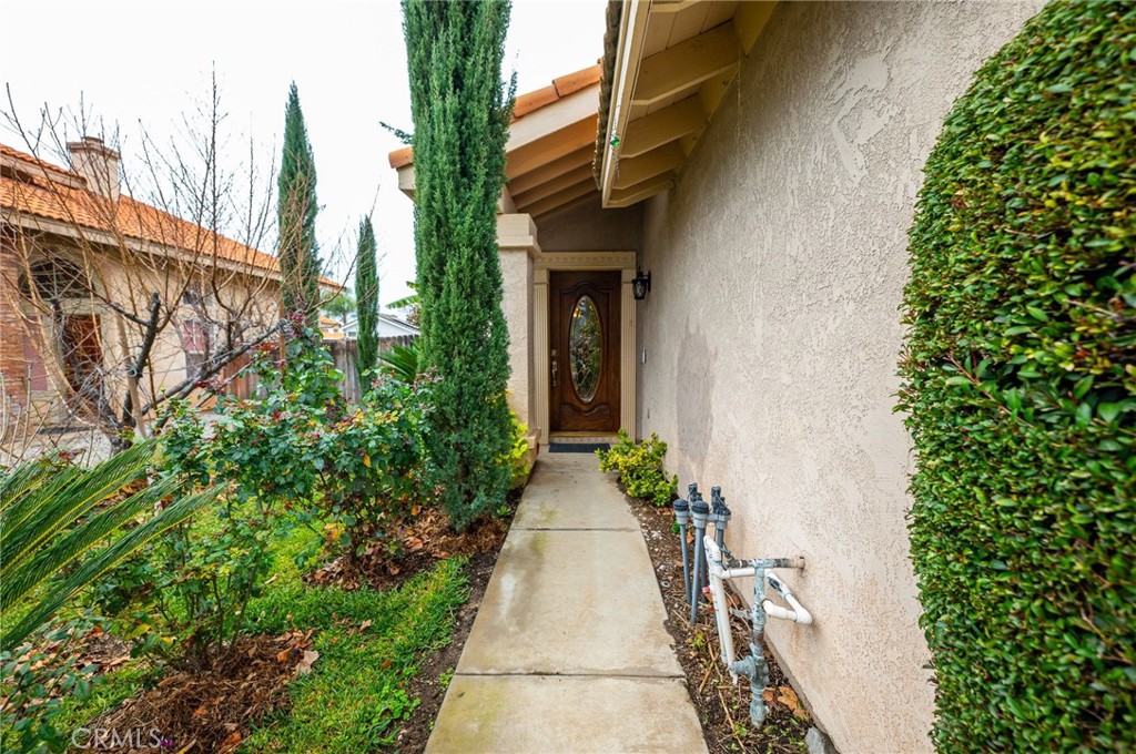 7444 Webster Street Highland, CA 92346 - Photo 4 of 37 a view of a pathway with house on both side