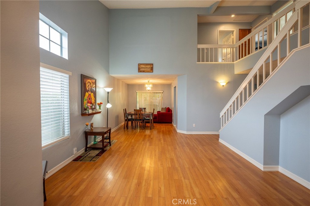 7444 Webster Street Highland, CA 92346 - Photo 6 of 37 a view of a room with wooden floor and stairs
