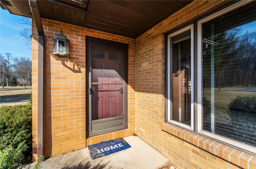 7059 Stewart Sharon Road Hubbard, OH 44425 - Photo 6 of 49 View of exterior entry with brick siding