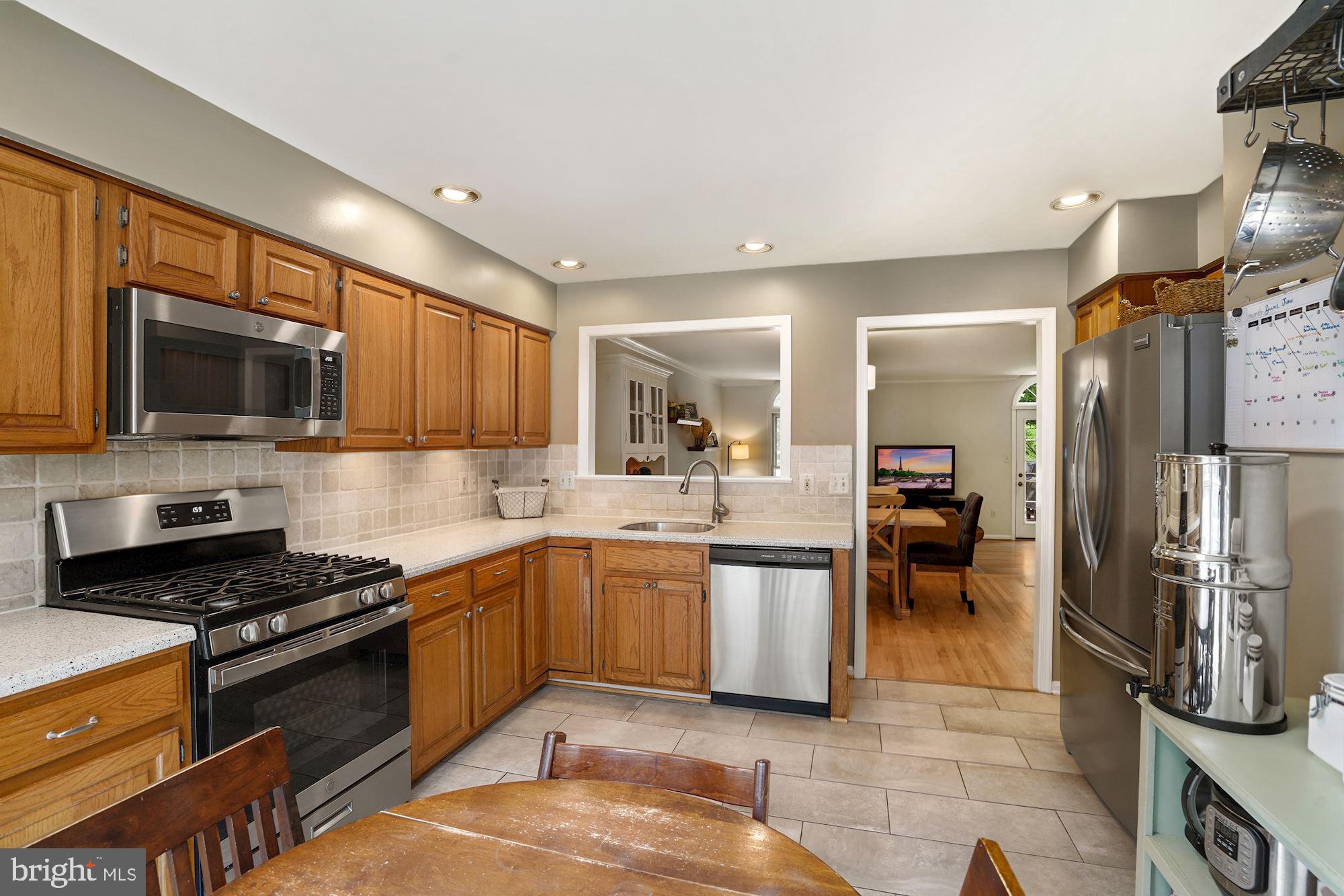 11730 Great Owl Circle Reston, VA 20194 - Photo 9 of 35 Kitchen with SS Appliances