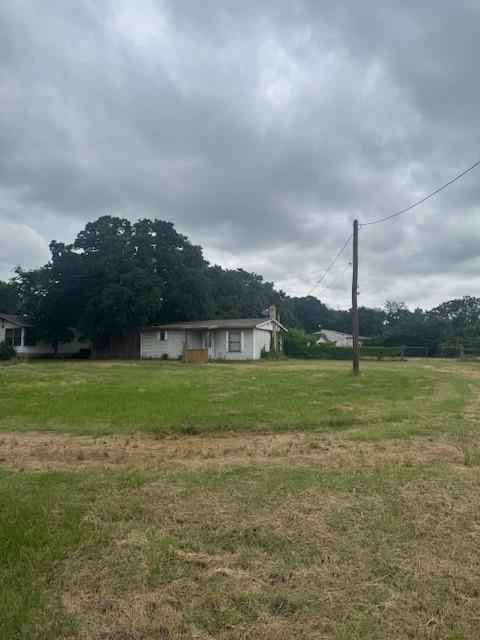 6355 Newt Patterson Road, Unit A Mansfield, TX 76063 - Photo 20 of 27 a view of a green field with wooden fence