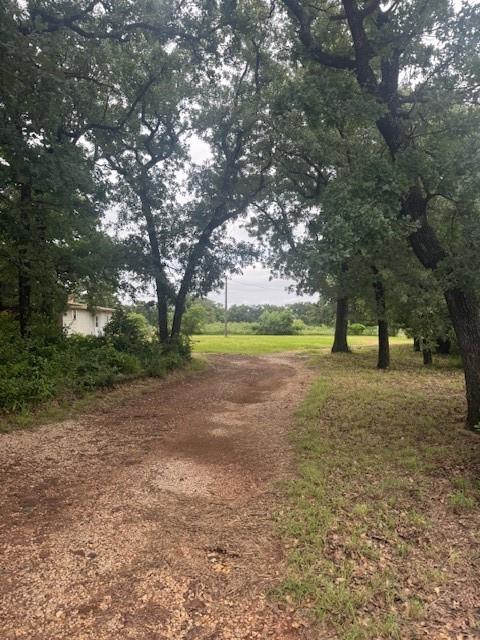 6355 Newt Patterson Road, Unit A Mansfield, TX 76063 - Photo 3 of 27 a view of outdoor space with deck and trees