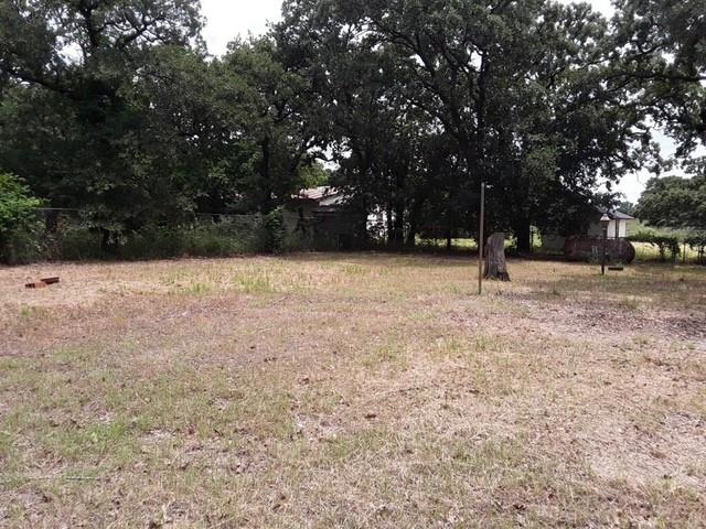 6355 Newt Patterson Road, Unit A Mansfield, TX 76063 - Photo 10 of 27 a backyard of a house with lots of trees