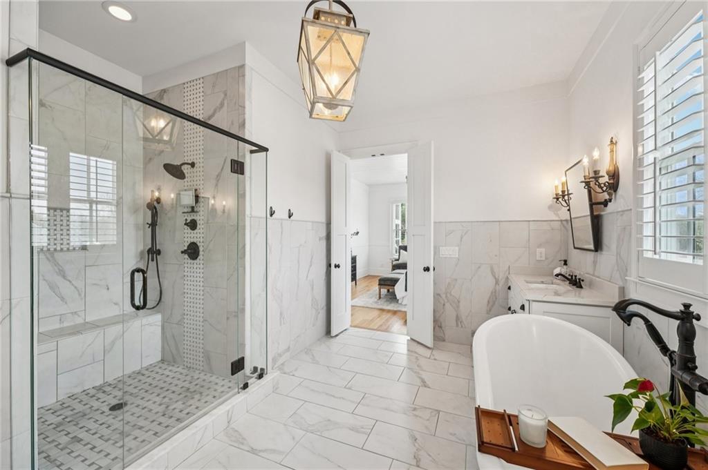 203 Trinity Way Canton, GA 30115 - Photo 22 of 77 a bathroom with a sink a toilet and shower
