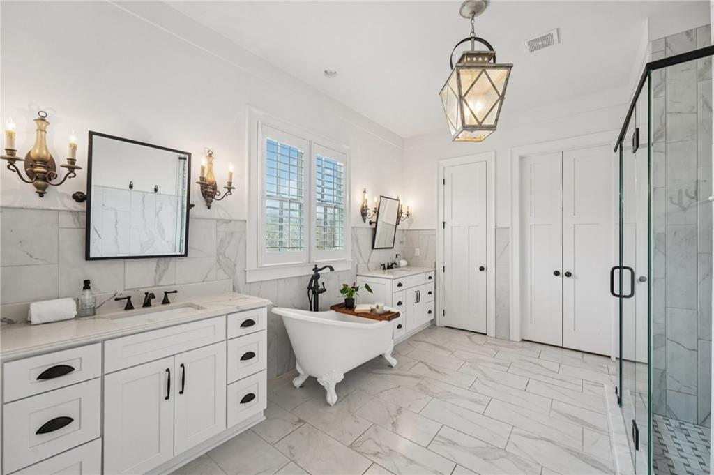 203 Trinity Way Canton, GA 30115 - Photo 24 of 77 a spacious bathroom with a double vanity sink mirror and shower