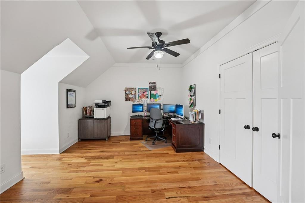 203 Trinity Way Canton, GA 30115 - Photo 47 of 77 a view of a workspace with furniture and wooden floor