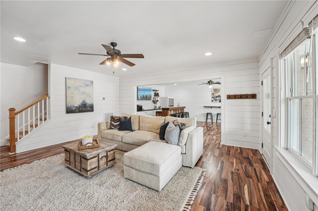 203 Trinity Way Canton, GA 30115 - Photo 55 of 77 a living room with furniture and a wooden floor