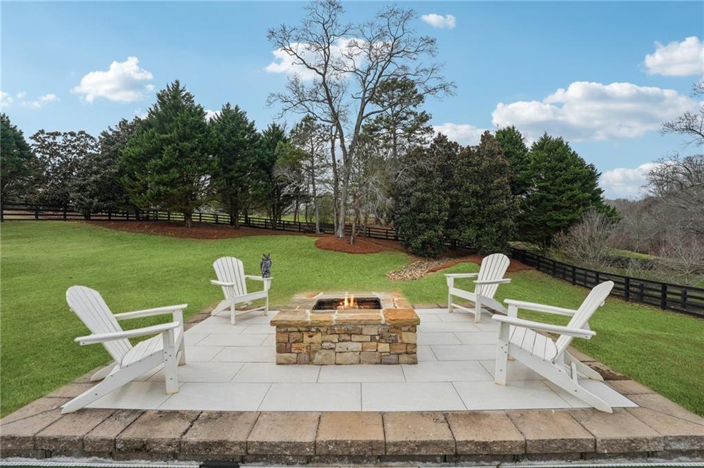 203 Trinity Way Canton, GA 30115 - Photo 68 of 77 a view of a chairs and table in the patio