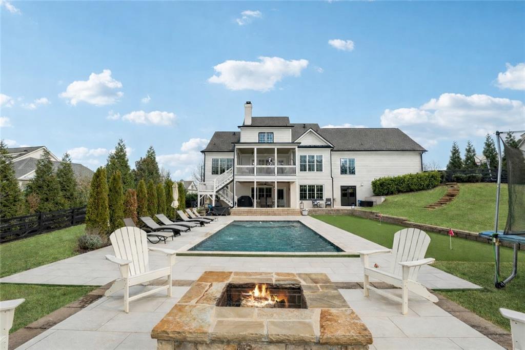 203 Trinity Way Canton, GA 30115 - Photo 76 of 77 a front view of a house with swimming pool having outdoor seating