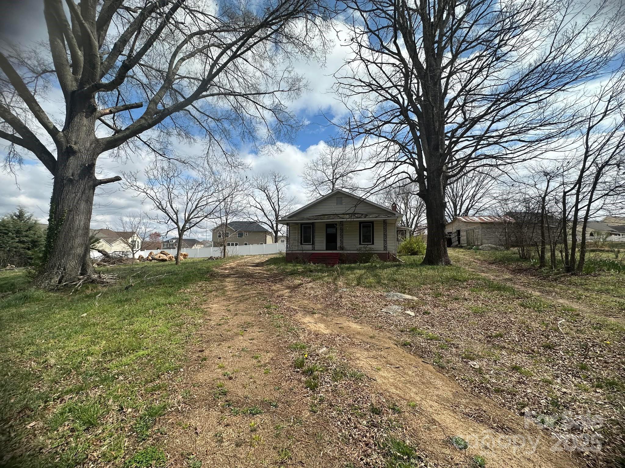 4349 Roberta Road Concord, NC 28027 - Photo 1 of 25 a front view of a house with a yard