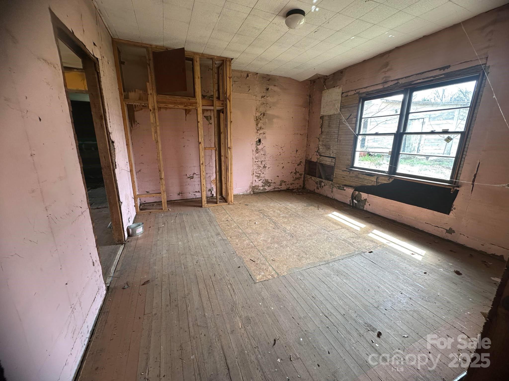 4349 Roberta Road Concord, NC 28027 - Photo 22 of 25 wooden floor in an empty room with a window