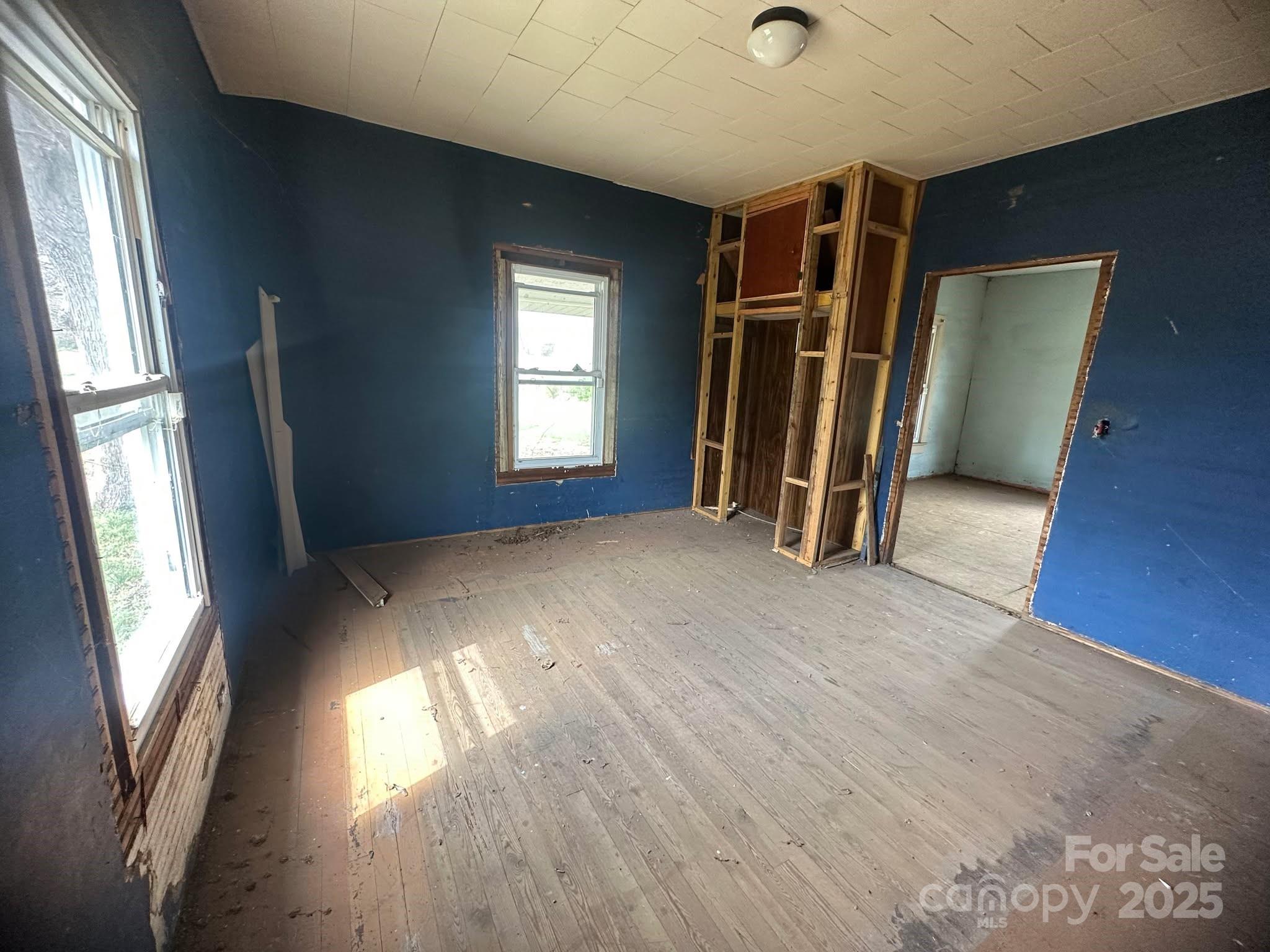 4349 Roberta Road Concord, NC 28027 - Photo 24 of 25 a view of empty room with wooden floor and fan