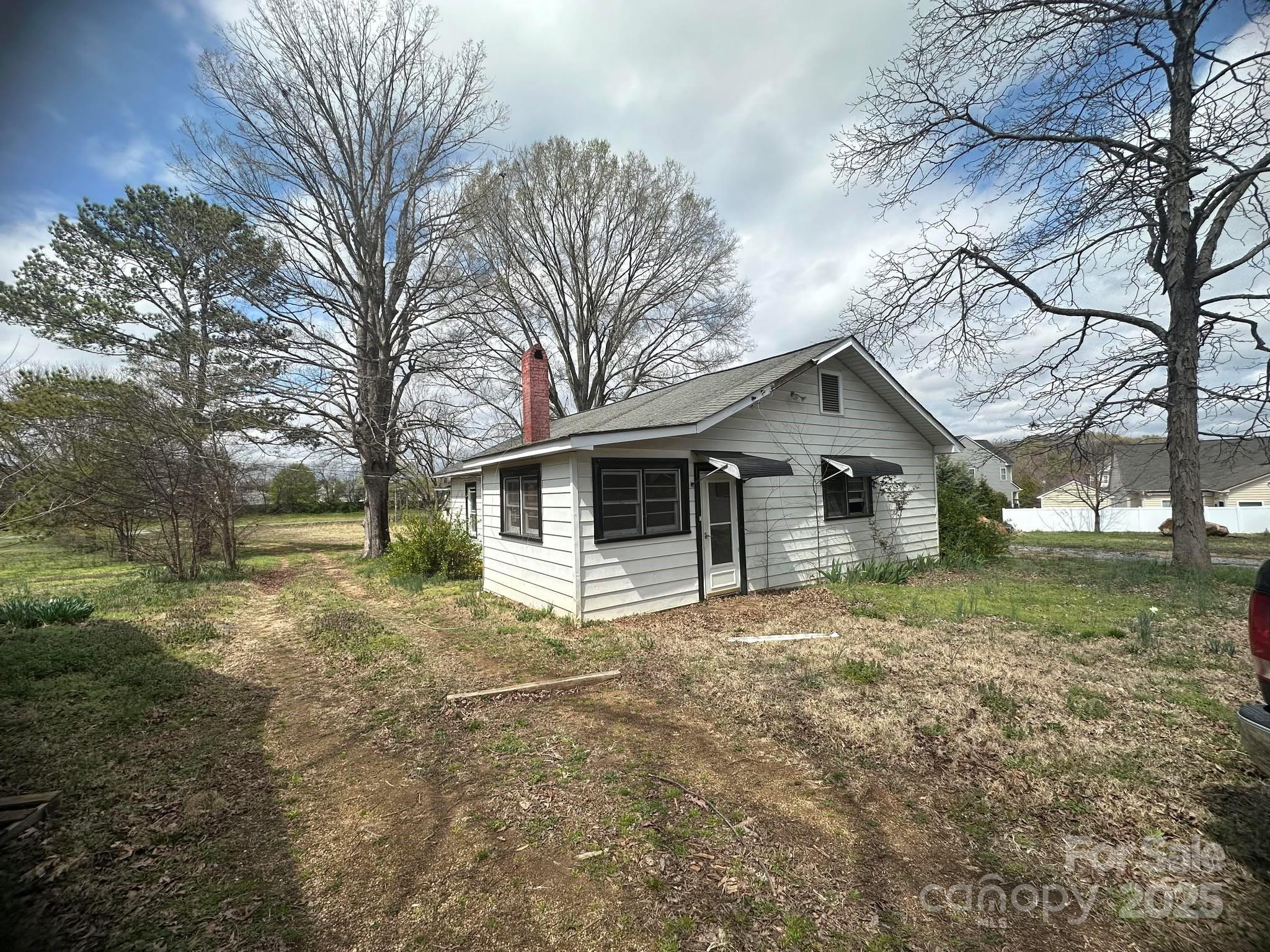 4349 Roberta Road Concord, NC 28027 - Photo 4 of 25 a front view of a house with garden
