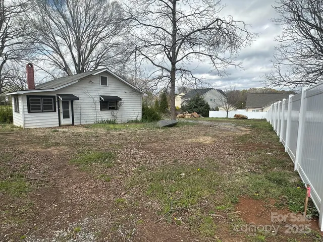 a house with trees in front of it