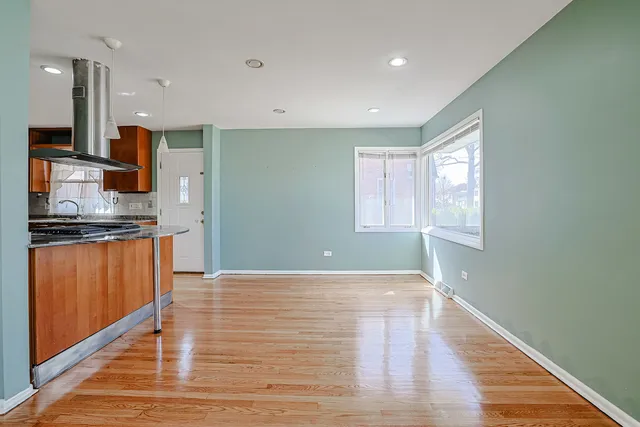 a view of kitchen with window and wooden floor