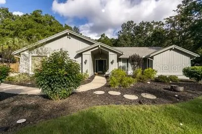 a view of a house with a yard and plants