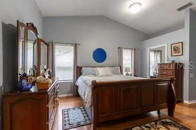 a bedroom with bed and window