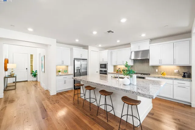 a kitchen with a table and chairs in it