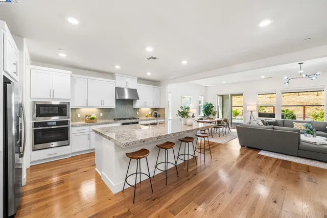 a large kitchen with a table and chairs in it