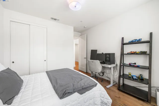 a bedroom with a bed and furniture