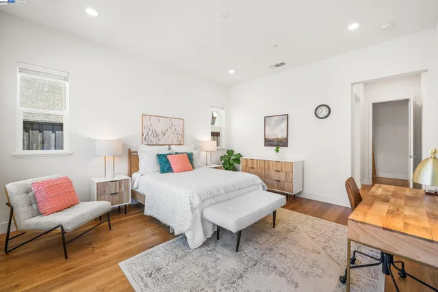 a bedroom with a bed and a couch