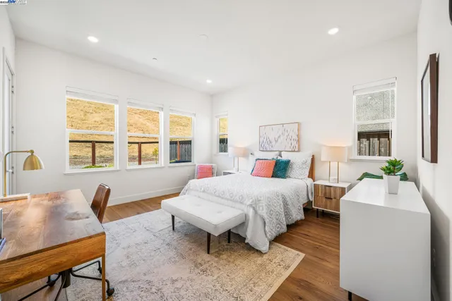 a bed room with a bed and a table