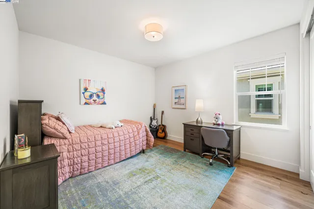 a bedroom with a workspace