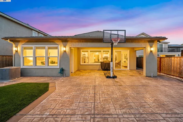 a view of a house with swimming pool in front of it