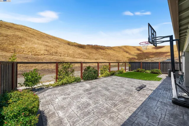 a view of a floor to ceiling window and chair in the room
