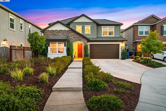 a view of a lake with a yard from a terrace