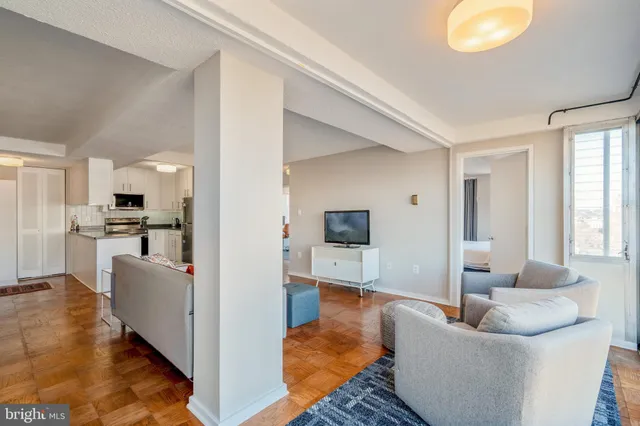 a living room with furniture and a table