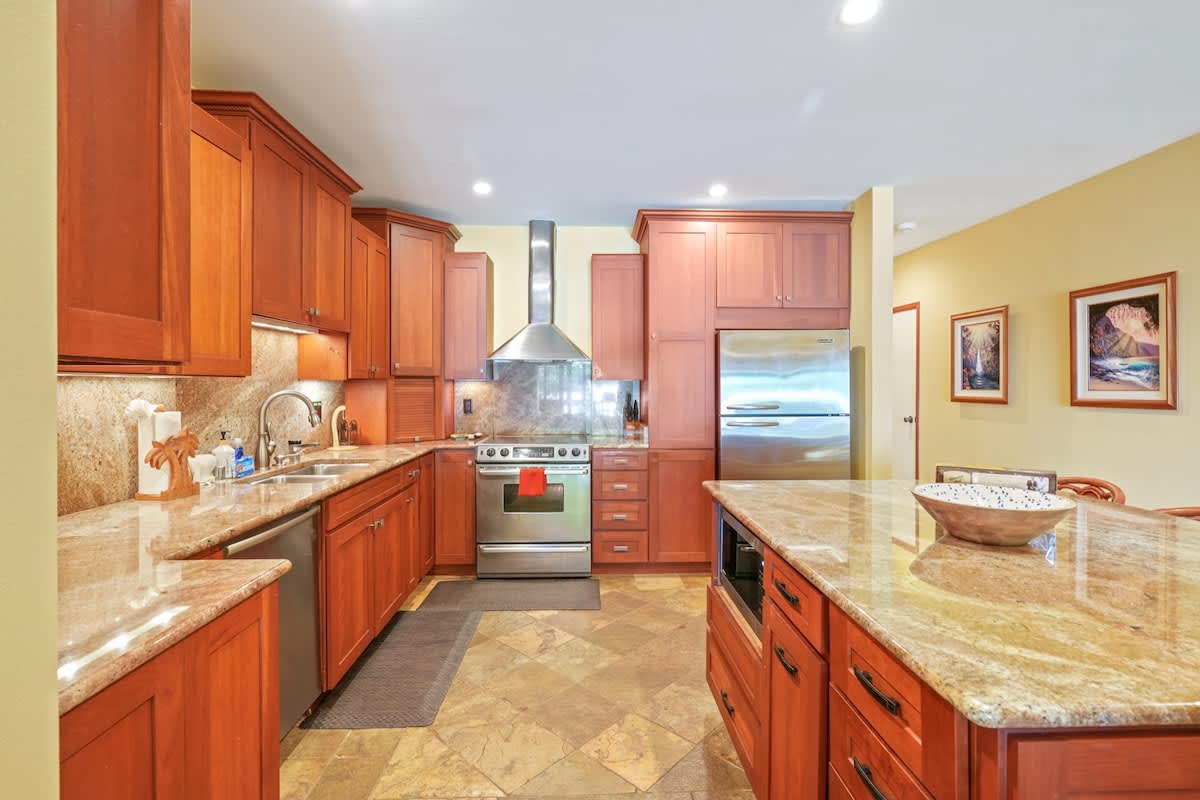 366 Papaloa Road, Unit 114 Kapaa, HI 96746 - Photo 13 of 23 a kitchen with stainless steel appliances granite countertop a sink stove and refrigerator