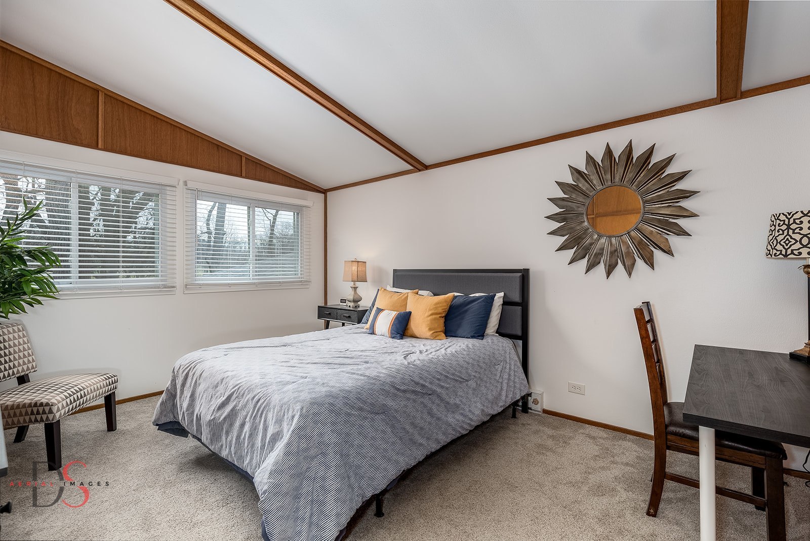 152 Beachview Court Varna, IL 61375 - Photo 13 of 46 a bedroom with a bed and a potted plant