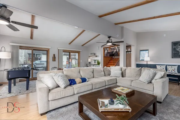 a living room with furniture and a large window