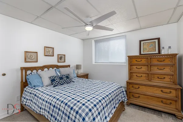 a bedroom with a bed and a dresser