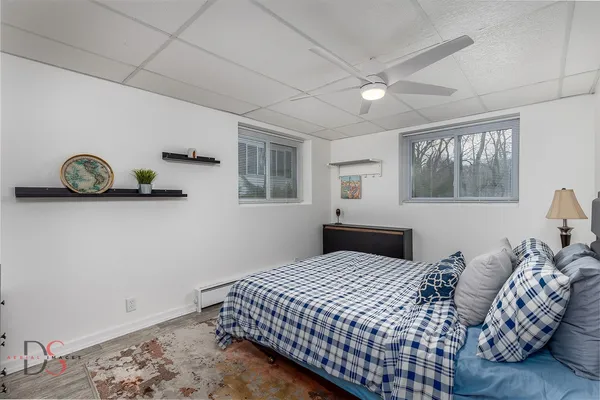 a bedroom with a bed and window