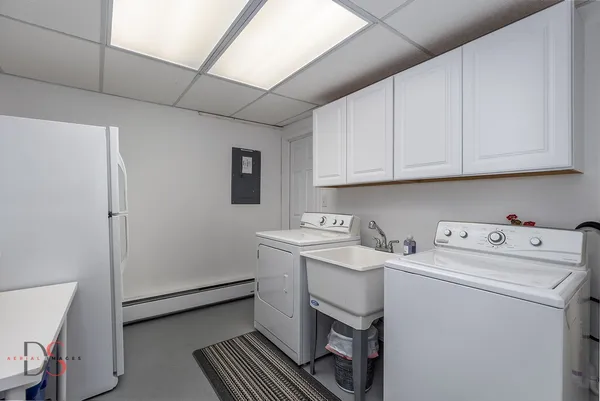 a view of storage and utility room with washer and dryer