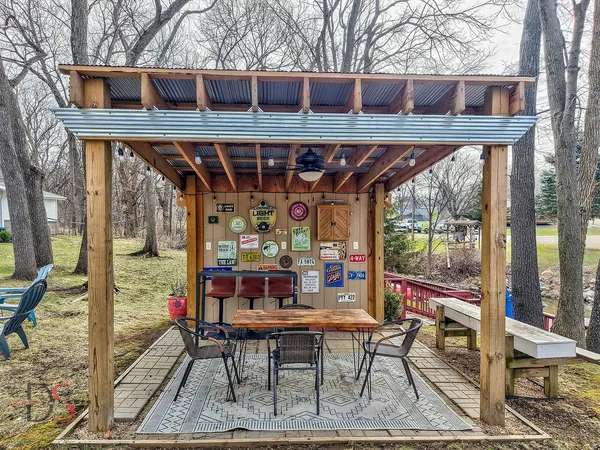 a view of a patio with a table and chairs