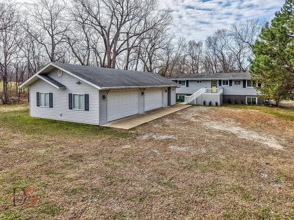 a house with trees in the background