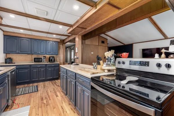 a kitchen with a stove and a sink