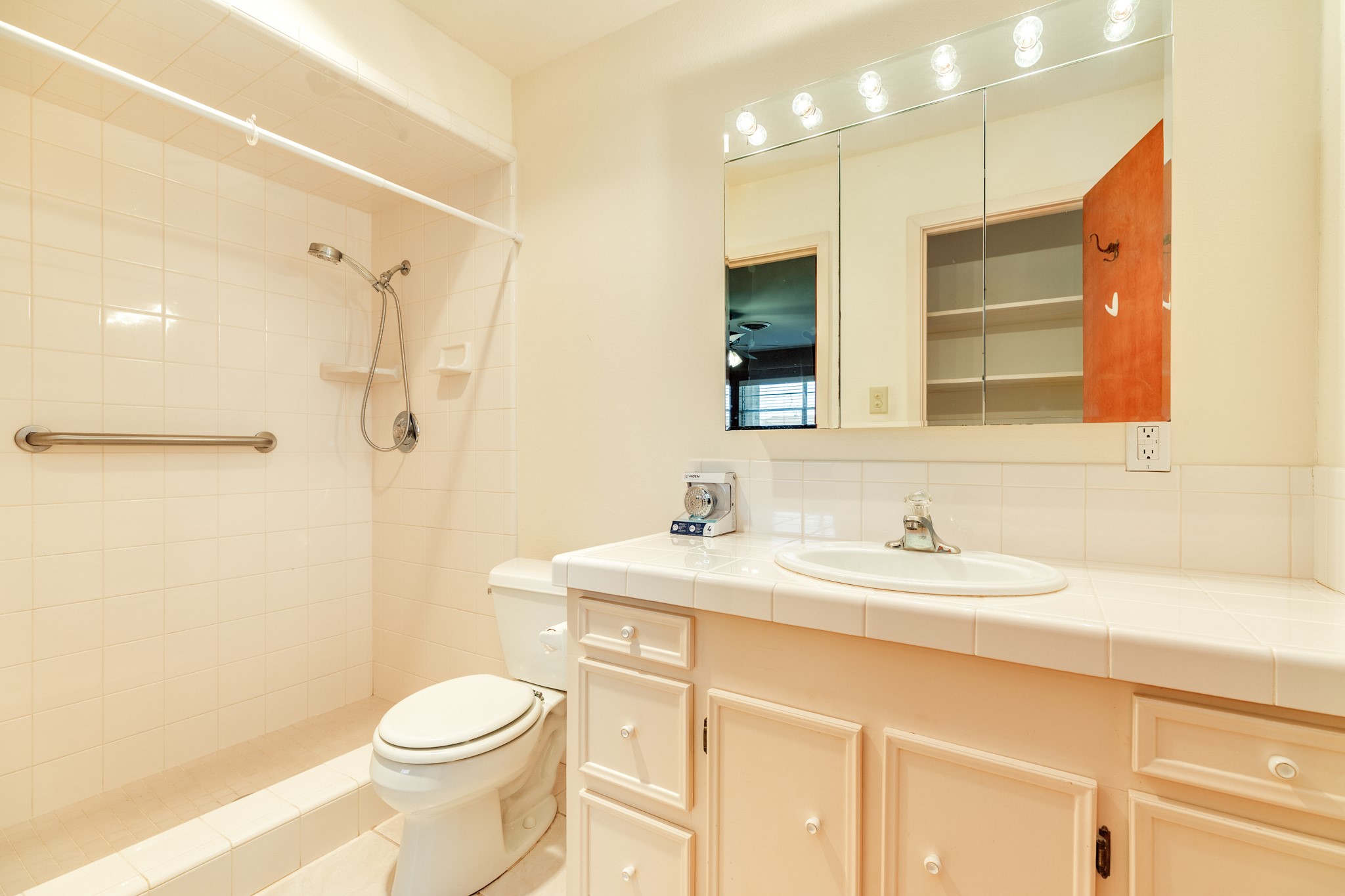 232 Magnolia Street Brazoria, TX 77422 - Photo 16 of 28 a bathroom with a sink a toilet and shower