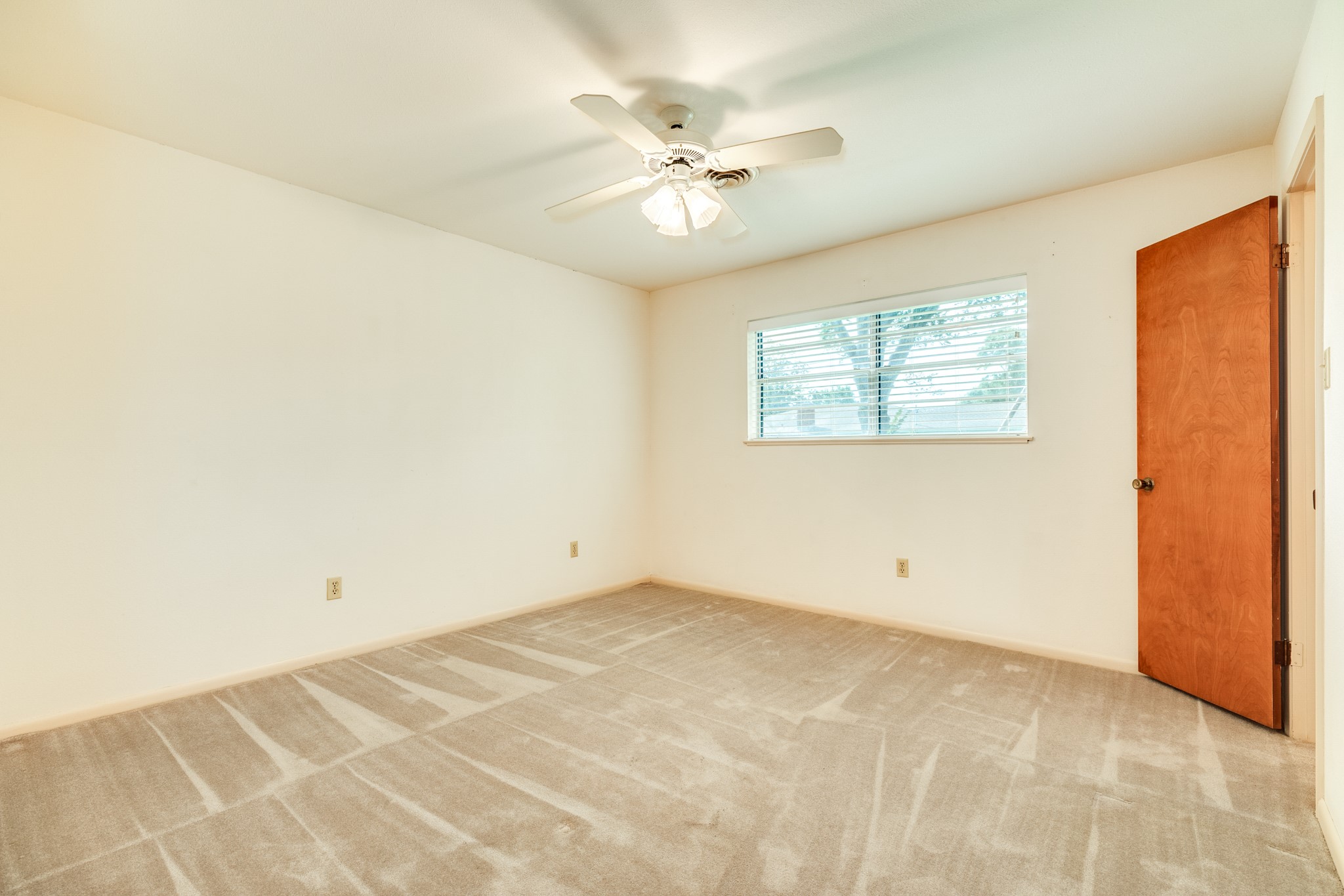 232 Magnolia Street Brazoria, TX 77422 - Photo 18 of 28 an empty room with windows and fan