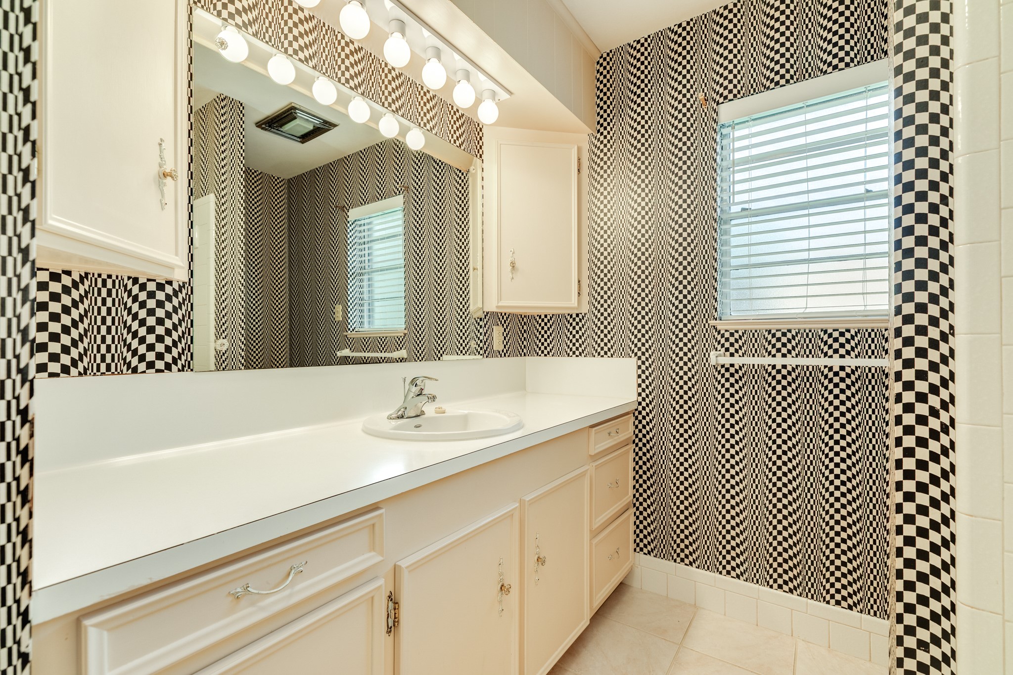 232 Magnolia Street Brazoria, TX 77422 - Photo 19 of 28 a bathroom with a sink a mirror and a bathtub