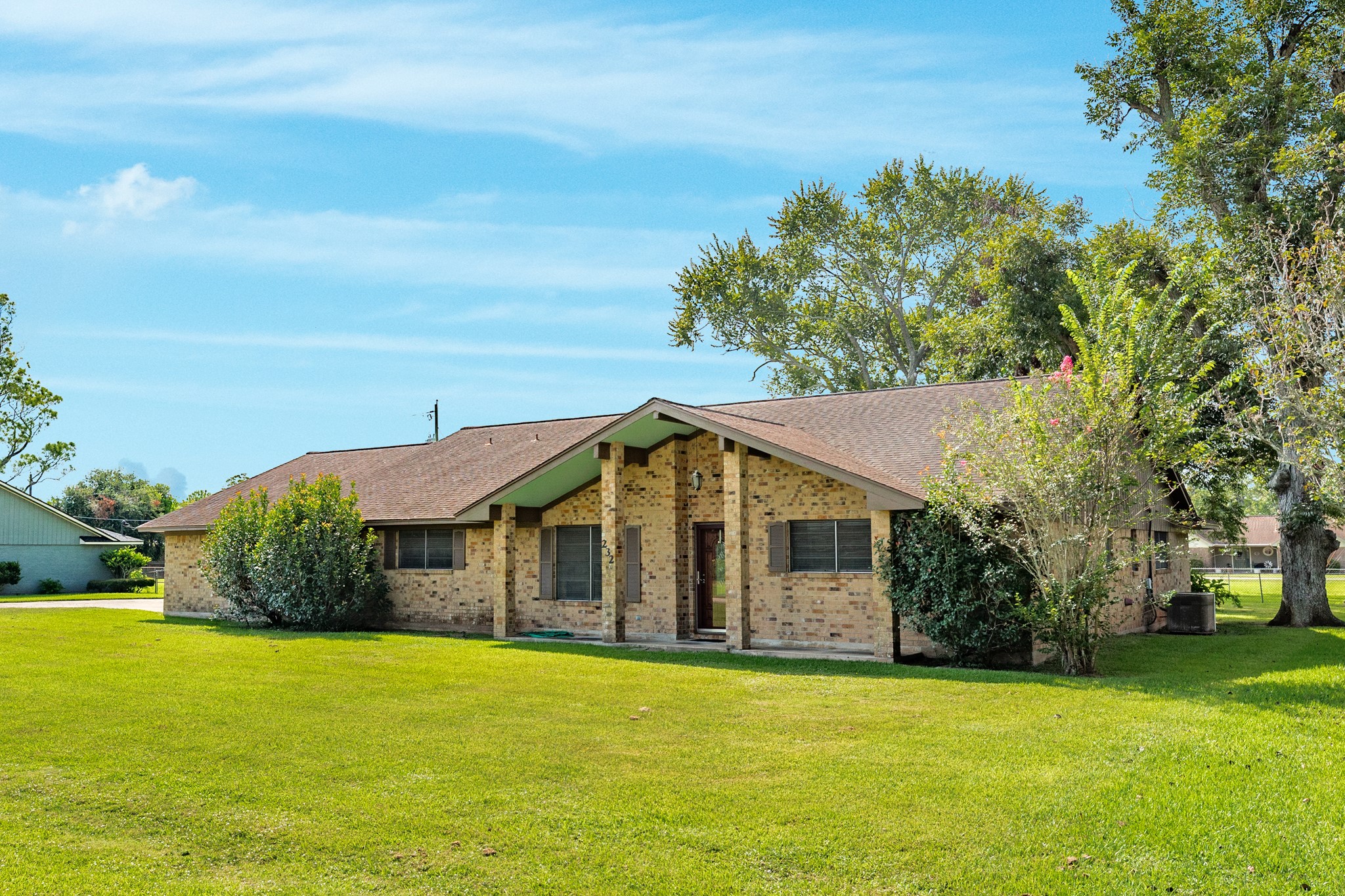 232 Magnolia Street Brazoria, TX 77422 - Photo 2 of 28 a view of a house with a yard