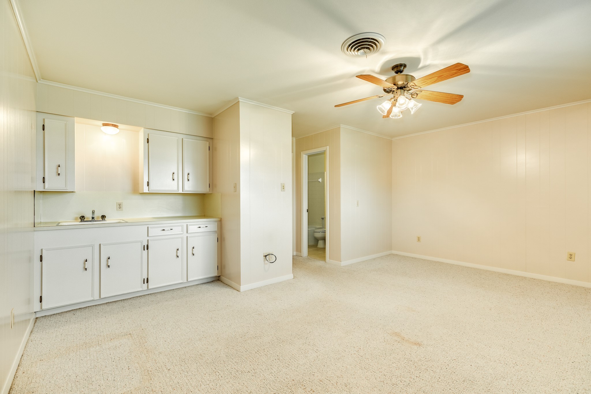 232 Magnolia Street Brazoria, TX 77422 - Photo 21 of 28 a view of a big room with chandelier fan and windows