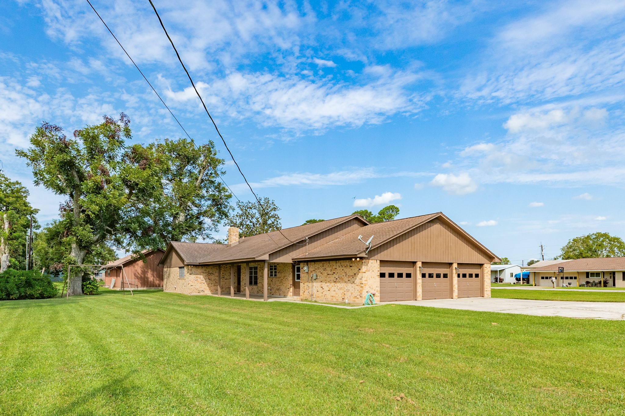 232 Magnolia Street Brazoria, TX 77422 - Photo 26 of 28 a front view of a house with a garden