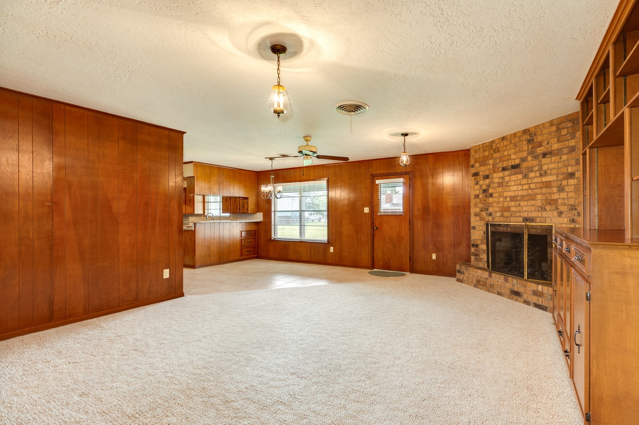 232 Magnolia Street Brazoria, TX 77422 - Photo 6 of 28 a view of an empty room with a fireplace