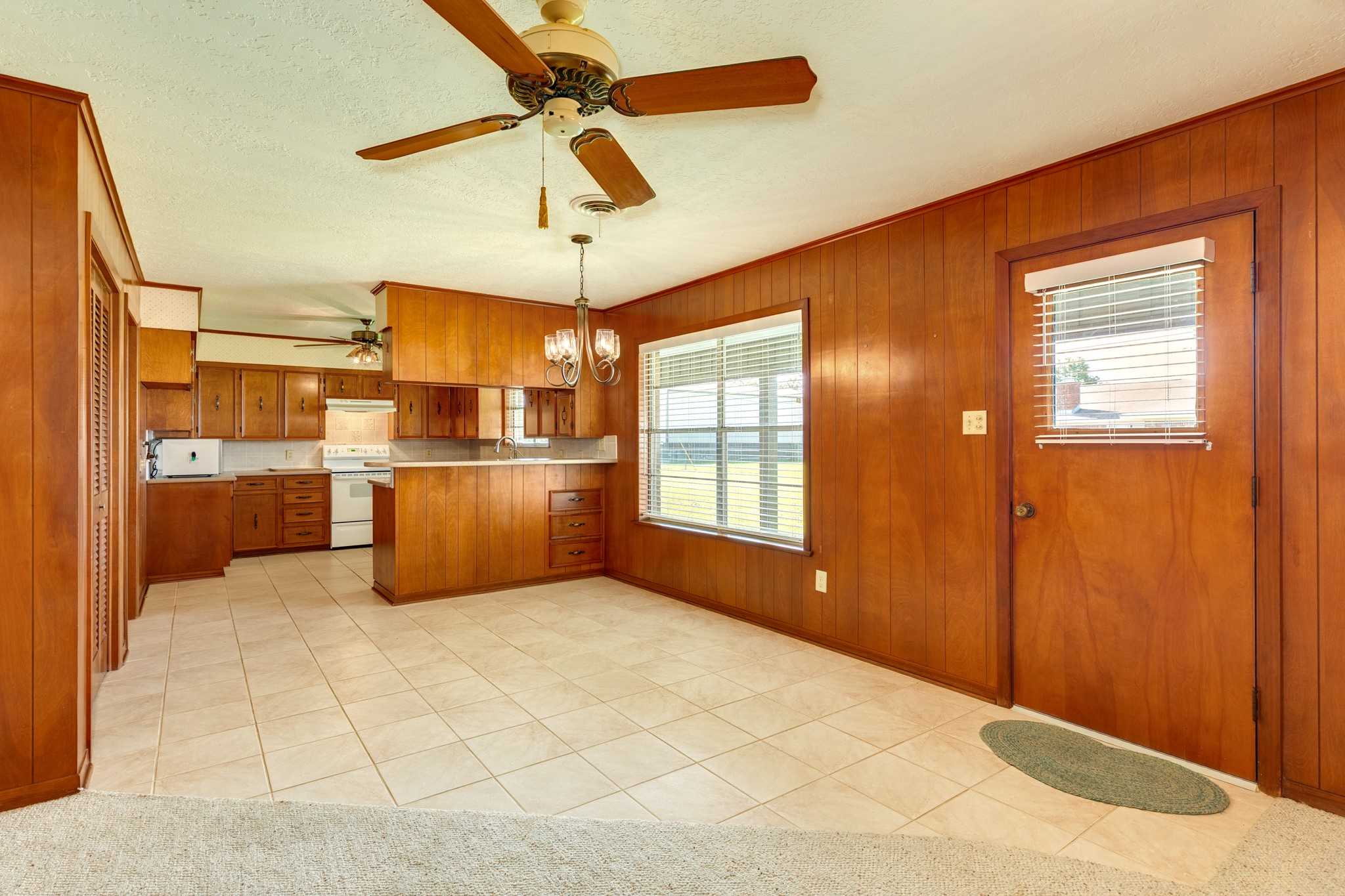 232 Magnolia Street Brazoria, TX 77422 - Photo 7 of 28 a open kitchen with stainless steel appliances kitchen island granite countertop a refrigerator a stove and a sink with granite countertops